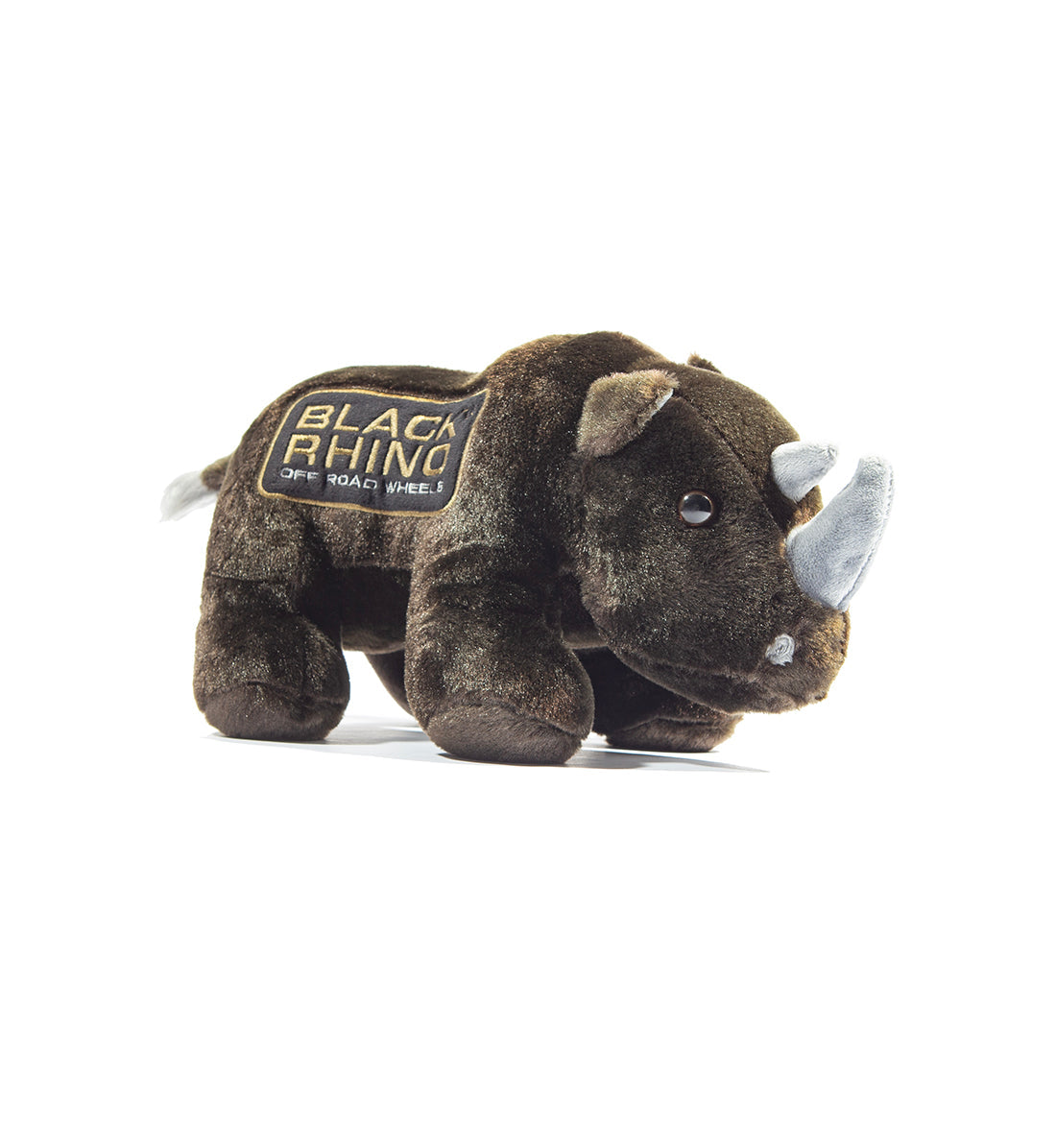 Black Rhino plush toy with soft black fur and distinct horn, sitting against a neutral background.