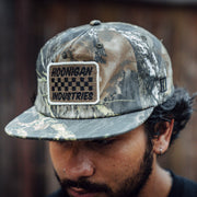 Hoonigan SPRINT unstructured snapback hat featuring a camouflage design and embroidered logo patch.