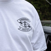White short sleeve t-shirt featuring Hoonigan Industries logo on the chest, designed for automotive enthusiasts.