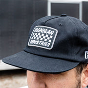 Hoonigan SPRINT unstructured snapback hat featuring a checkered logo and adjustable strap for a casual, stylish look.