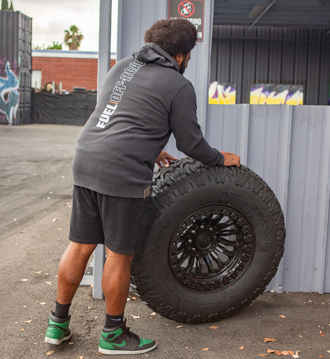 Fuel CUT Pullover Hoodie in gray, showcasing a back view with a modern design and lifestyle setting.