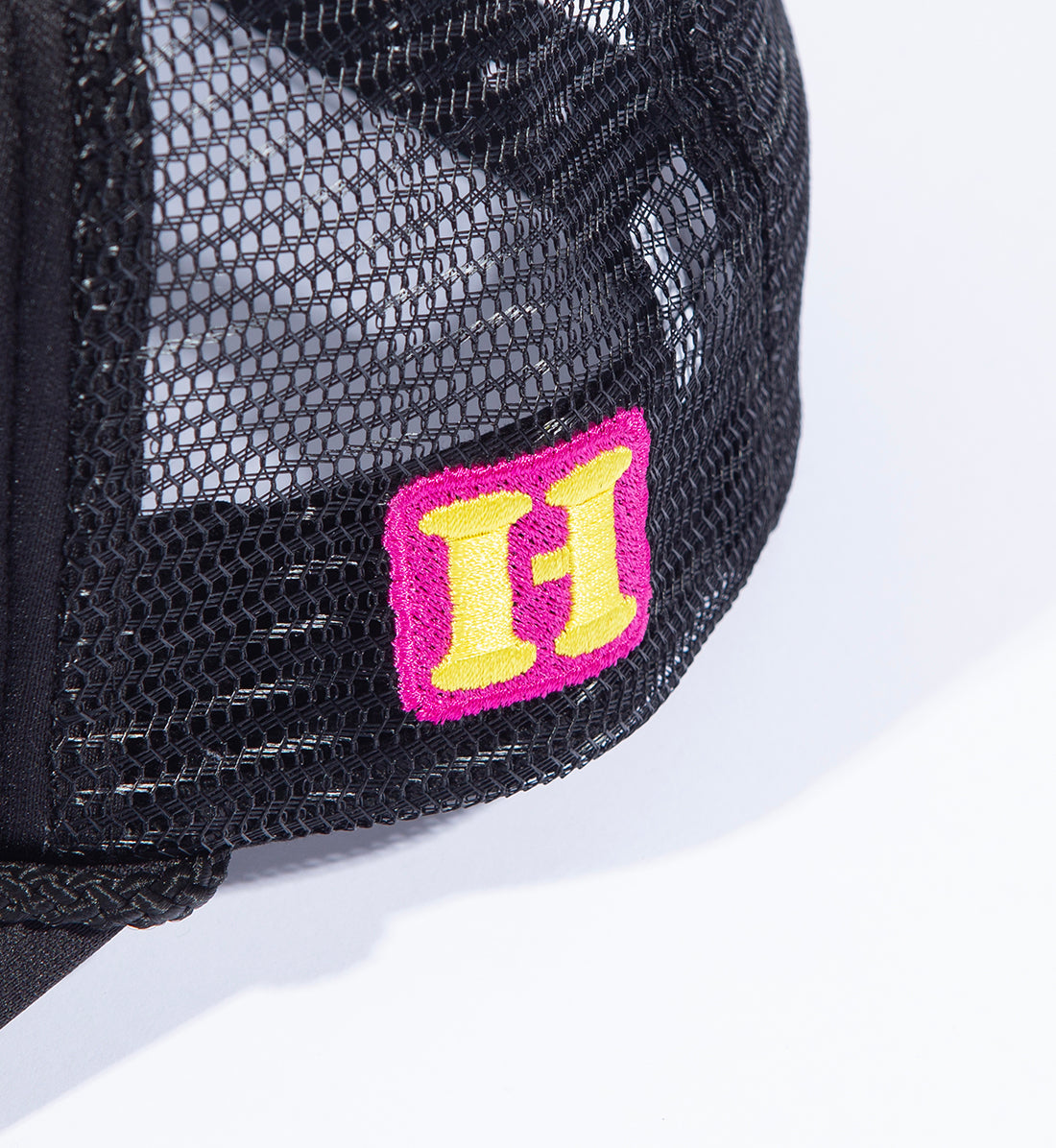 Hoonigan GET LOST Trucker Hat in black with adjustable snapback and embroidered logo details.