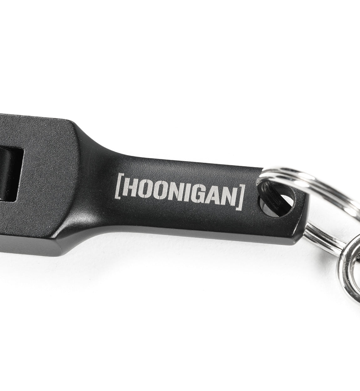 Hoonigan FOUND IT Keychain featuring a sleek black design with the brand name engraved for automotive enthusiasts.