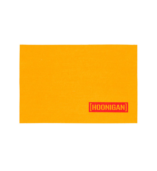Bright yellow chamois with a bold red Hoonigan logo, perfect for automotive enthusiasts and detailing needs.