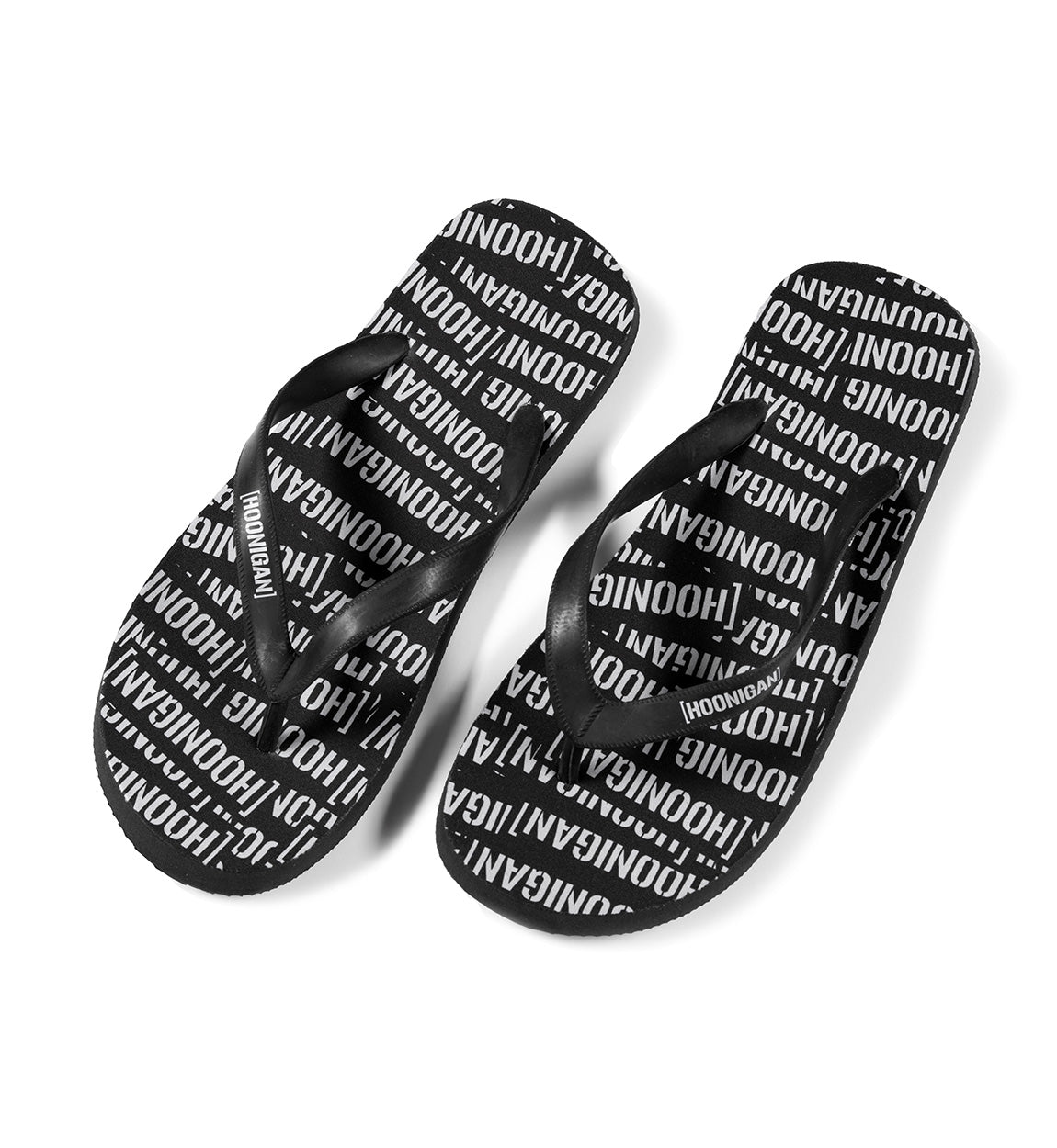 Hoonigan SCATTER flip flops featuring a black and gray design with bold logo and graphics.