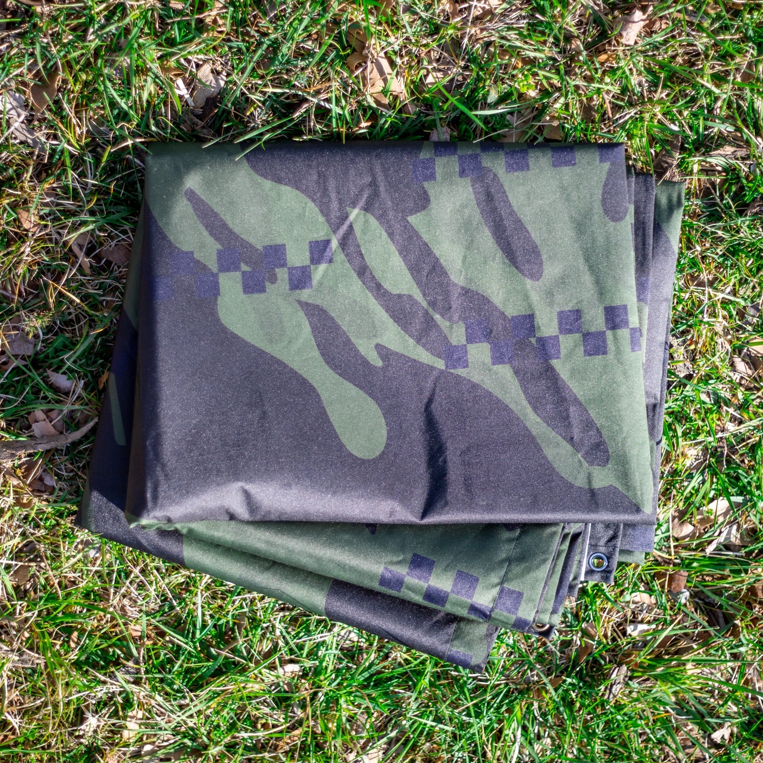 Hoonigan DISTRUPTIVE Nylon Tarp featuring a vibrant design, durable fabric, and reinforced edges, ideal for outdoor use and versatile applications.
