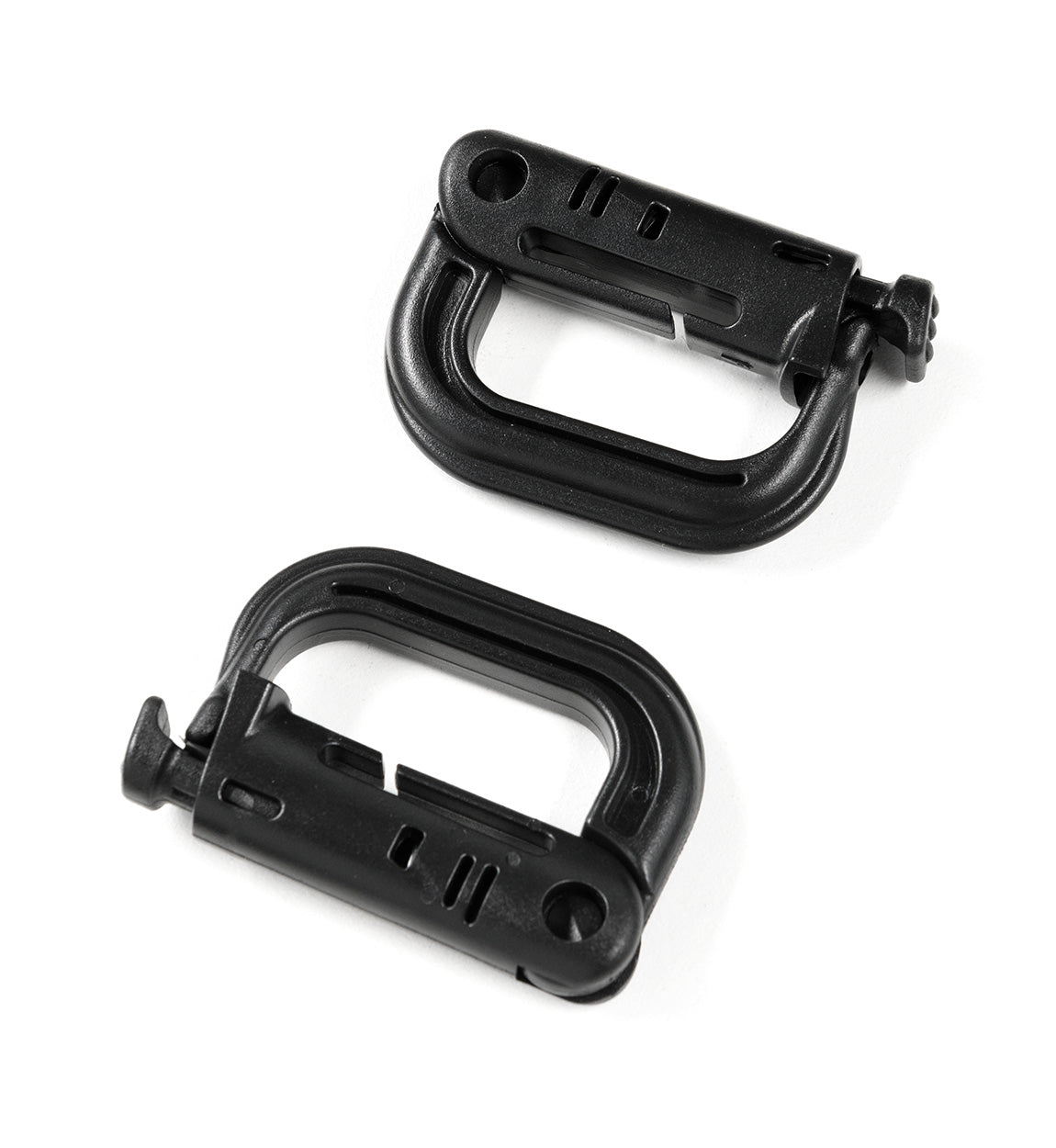 Pair of black safety harness buckles from the Hoonigan OH SH*T Safety Kit, designed for secure vehicle safety and quick release.