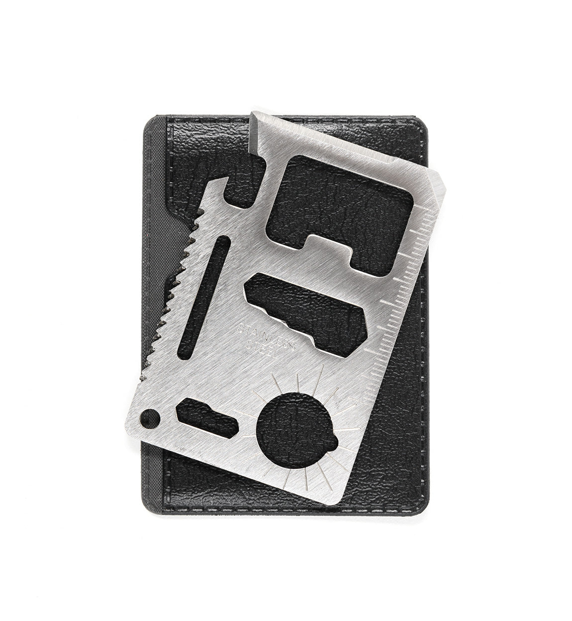 Stainless steel Hoonigan OH SH*T Safety Kit multi-tool with ruler, saw, and bottle opener, displayed on a black case.