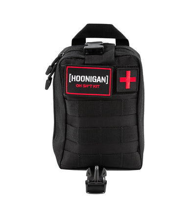 Black Hoonigan OH SH*T Safety Kit bag with red and white logo patch, red cross patch, and multiple compartments for emergency gear.