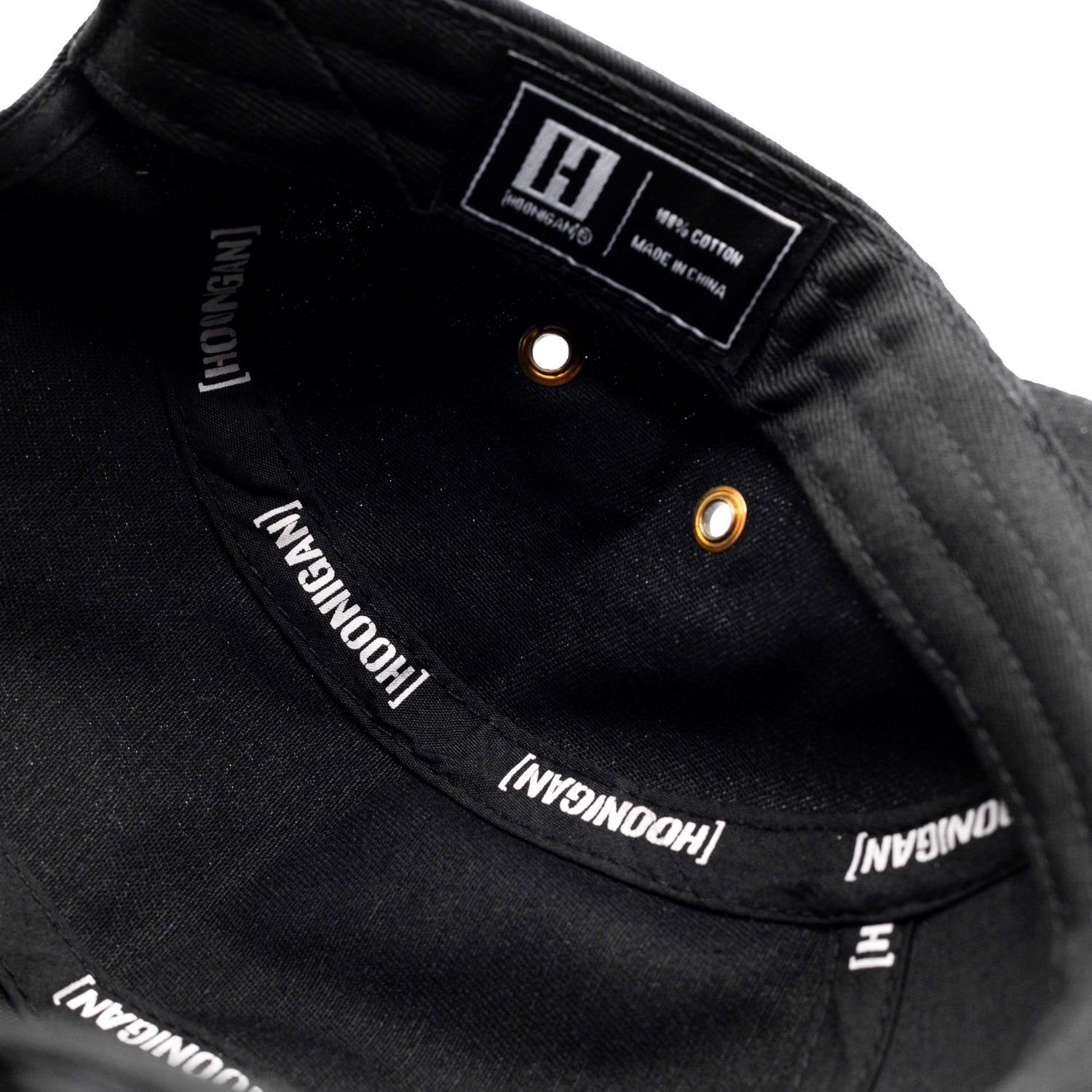 Hoonigan SURGEON GENERAL Camper Hat featuring a camouflage design and embroidered logo on the front.