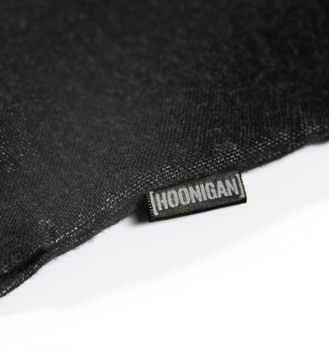 Hoonigan DONUT GARAGE black woven short sleeve button-up shirt featuring a graphic logo on the left chest.
