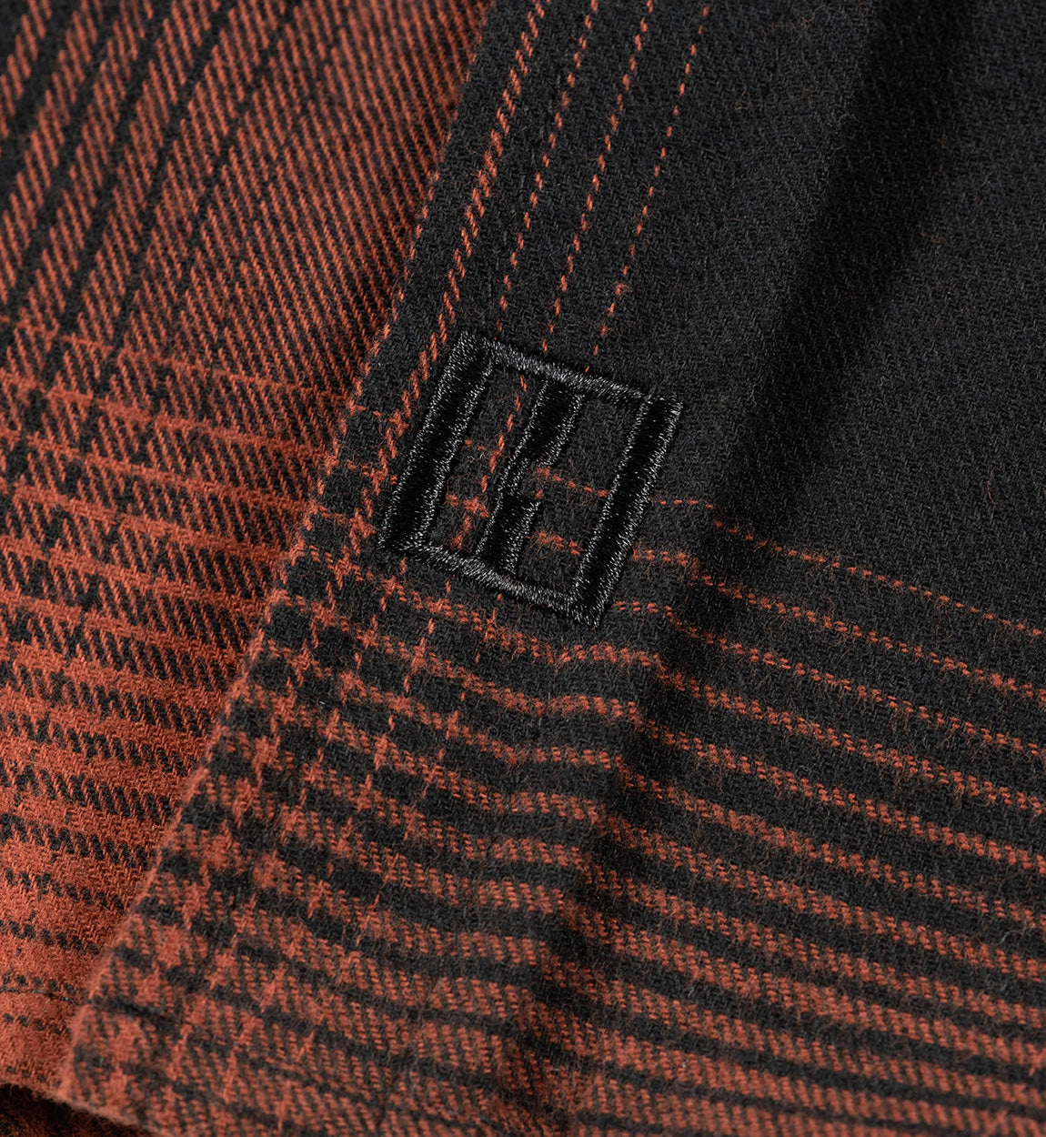 Dress up and stay warm with the NEW NEW Hoonigan RUST woven flannel.
