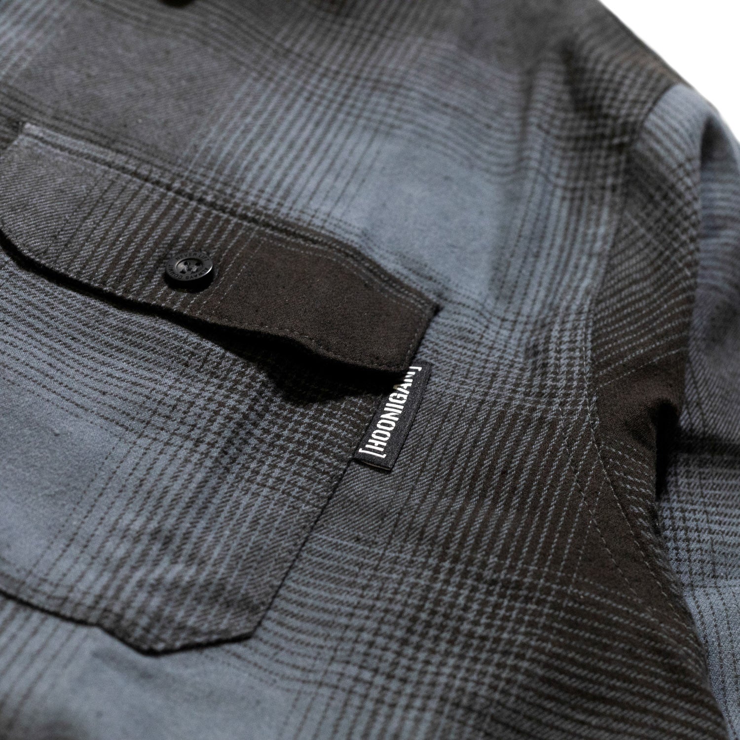 Hoonigan RUST Long Sleeve Flannel Shirt in red and gray checkered pattern, featuring button-up front and stylish collar.