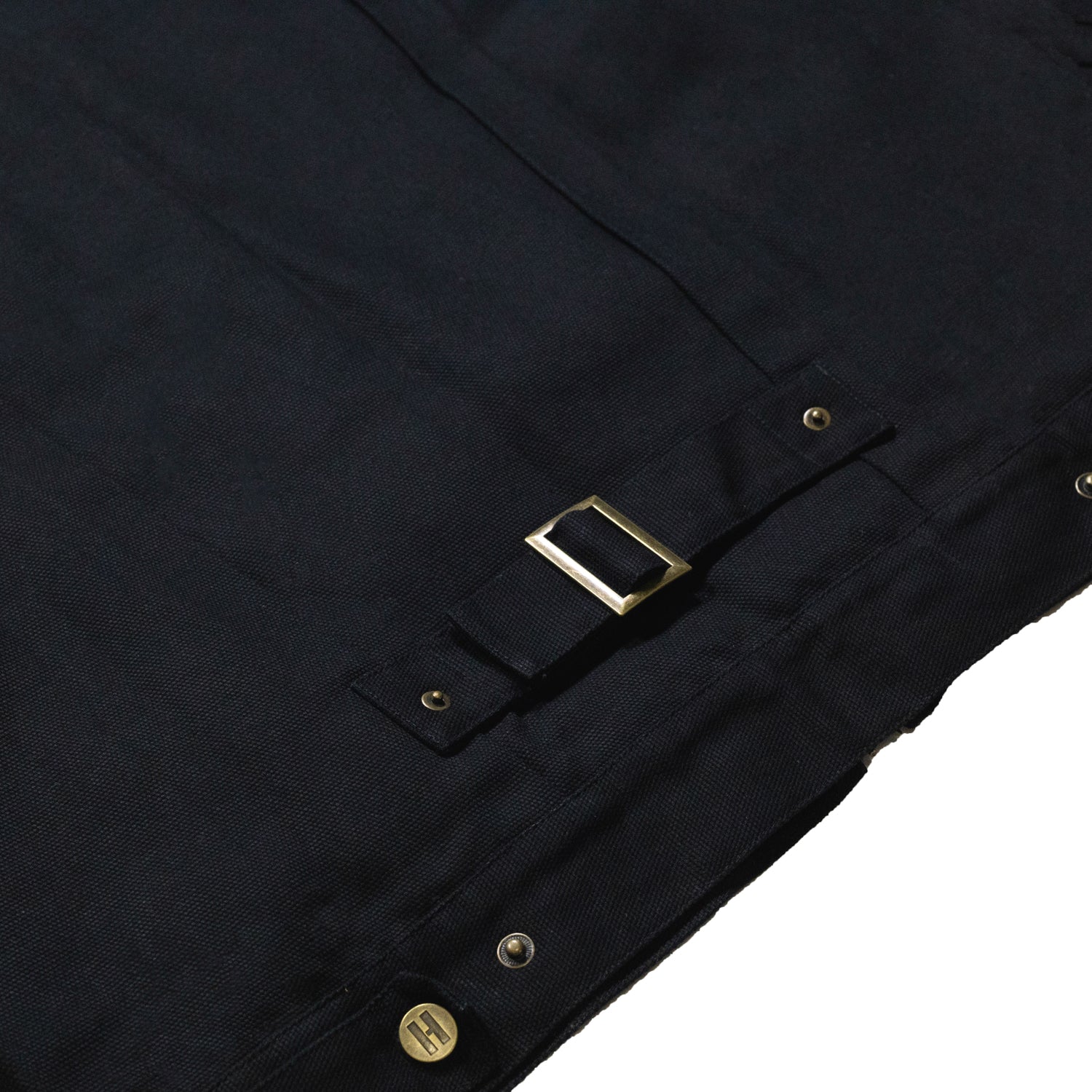 Hoonigan KNUCKLEBUSTERS jacket featuring a bold black design with embroidered logo on the front and graphics on the back.