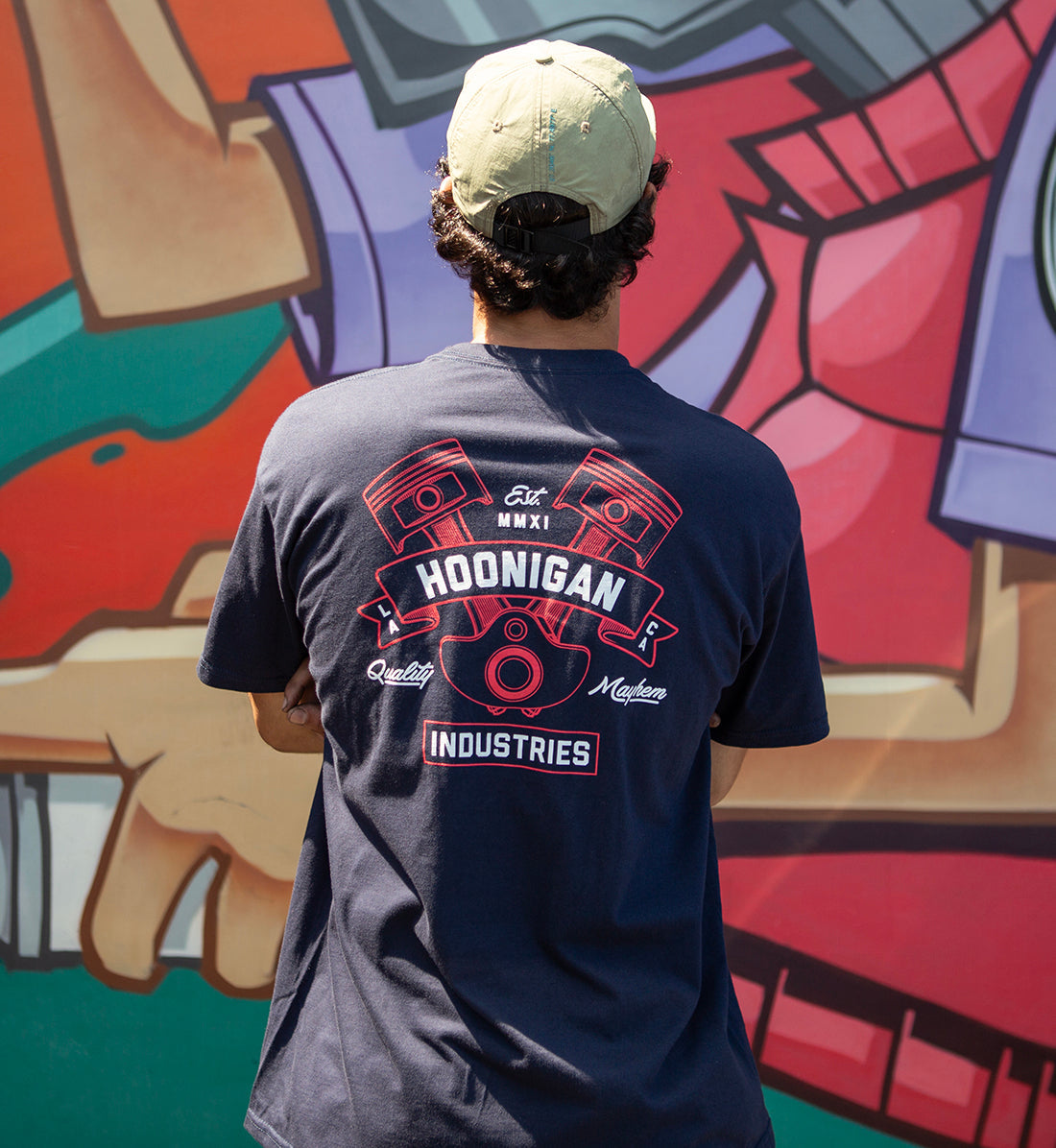 Hoonigan CRANKED Short Sleeve Tee featuring a bold graphic design on the back, in a stylish navy blue color.