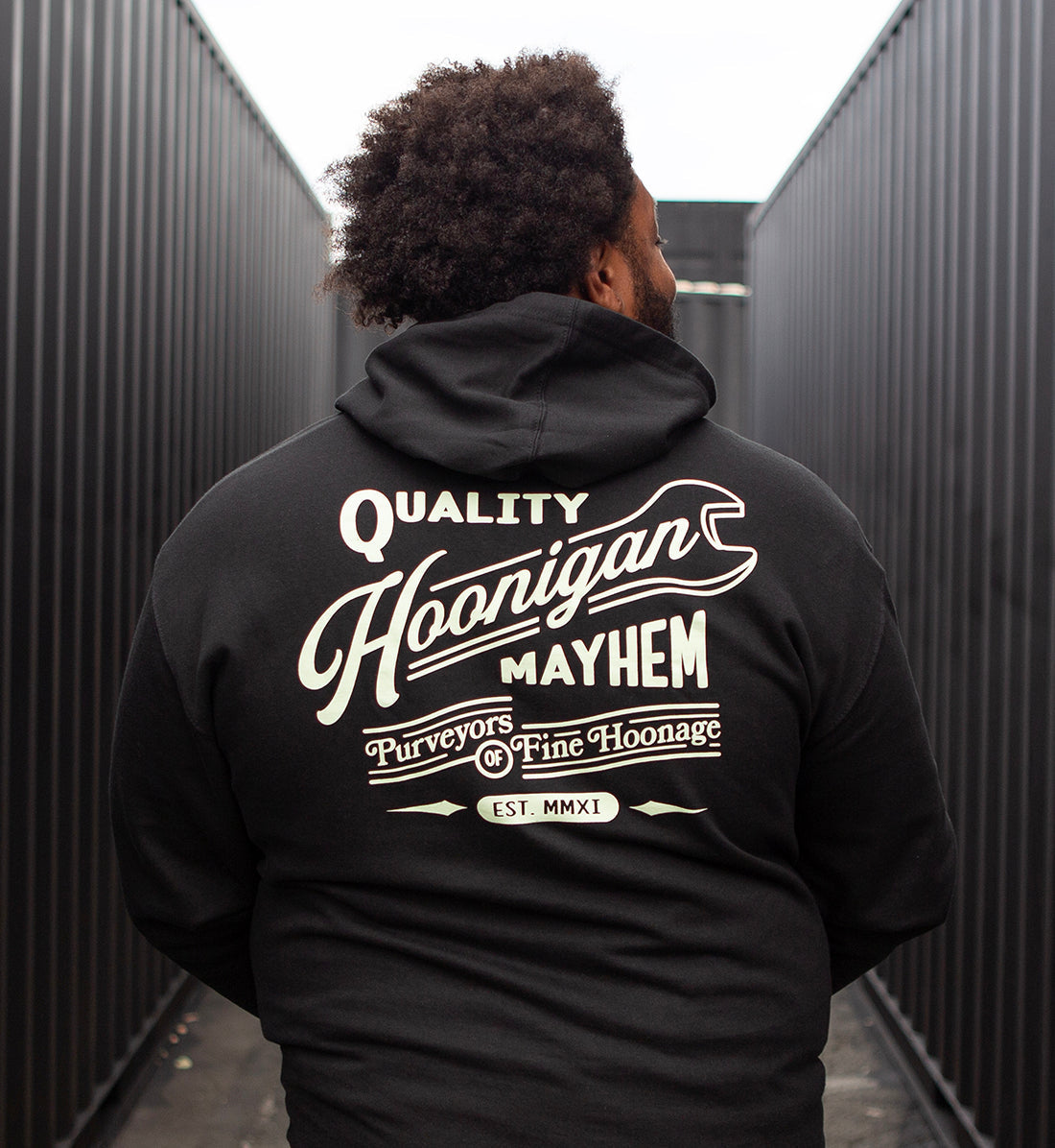 Hoonigan BACKDATE pullover hoodie in black, featuring a graphic logo design on the back and a comfortable fit.