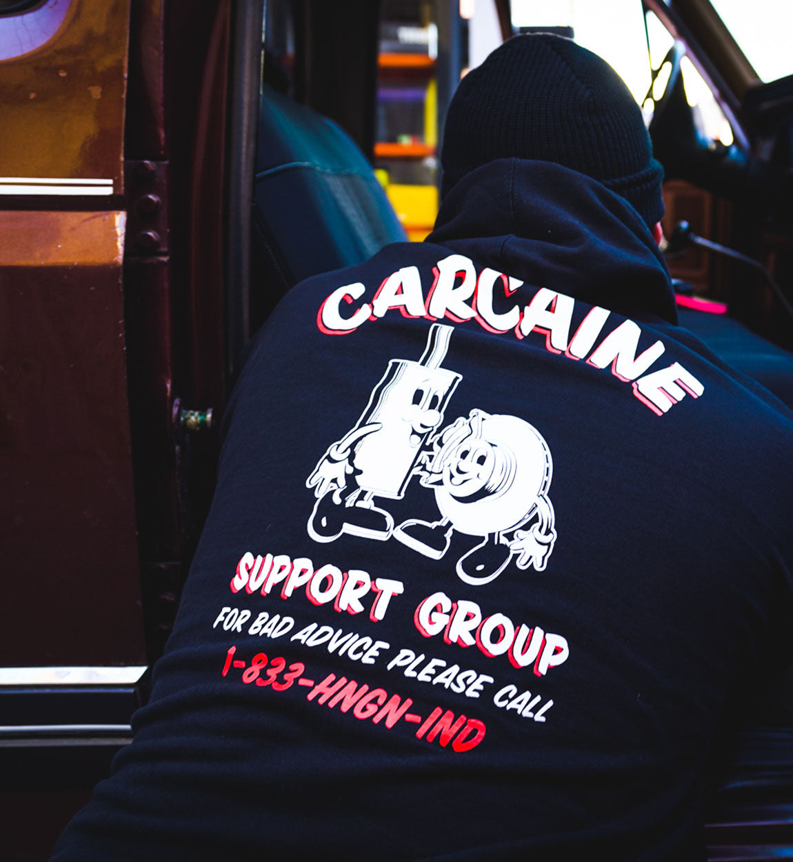 Hoonigan CARCAINE SUPPORT GROUP black pullover hoodie with white text and graphic design.