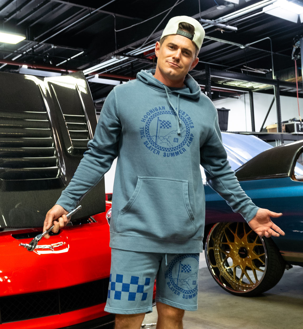 Hoonigan TIRE SLAYER SUMMER CAMP Shorts in light blue featuring a black graphic print and elastic waistband.