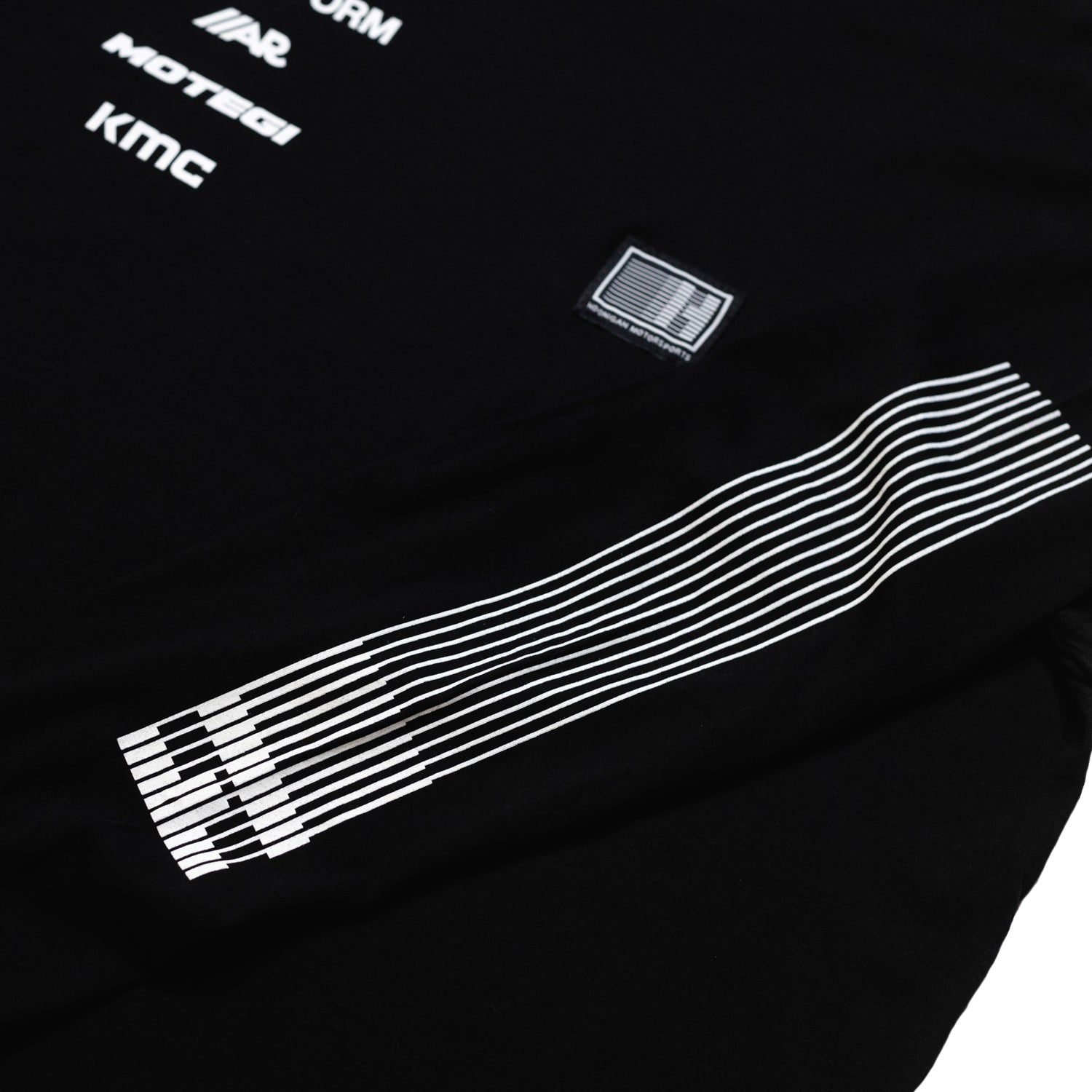 Hoonigan Motorsports long sleeve tee, featuring a vibrant graphic design on the front and sleeve.