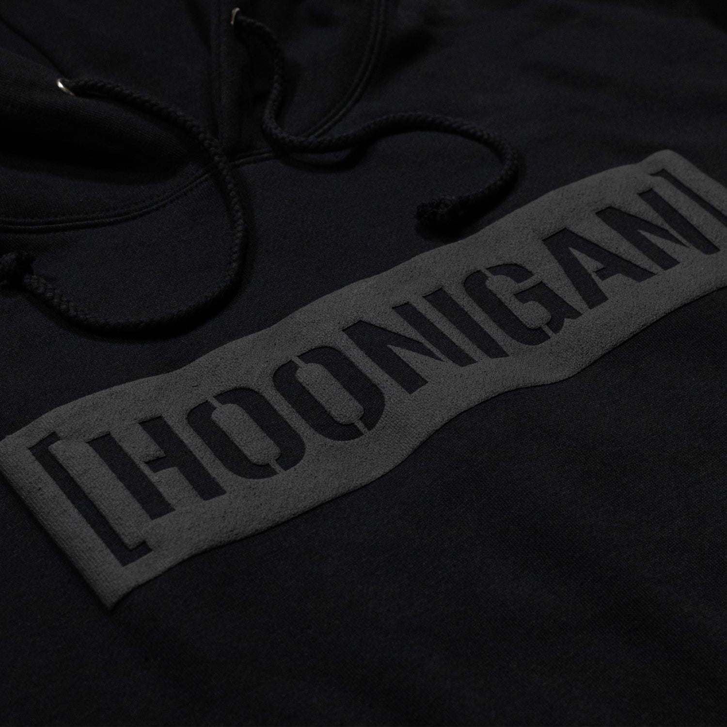 Hoonigan AIRBAGS CENSOR BAR Pullover Hoodie in black featuring a bold graphic design on the front.