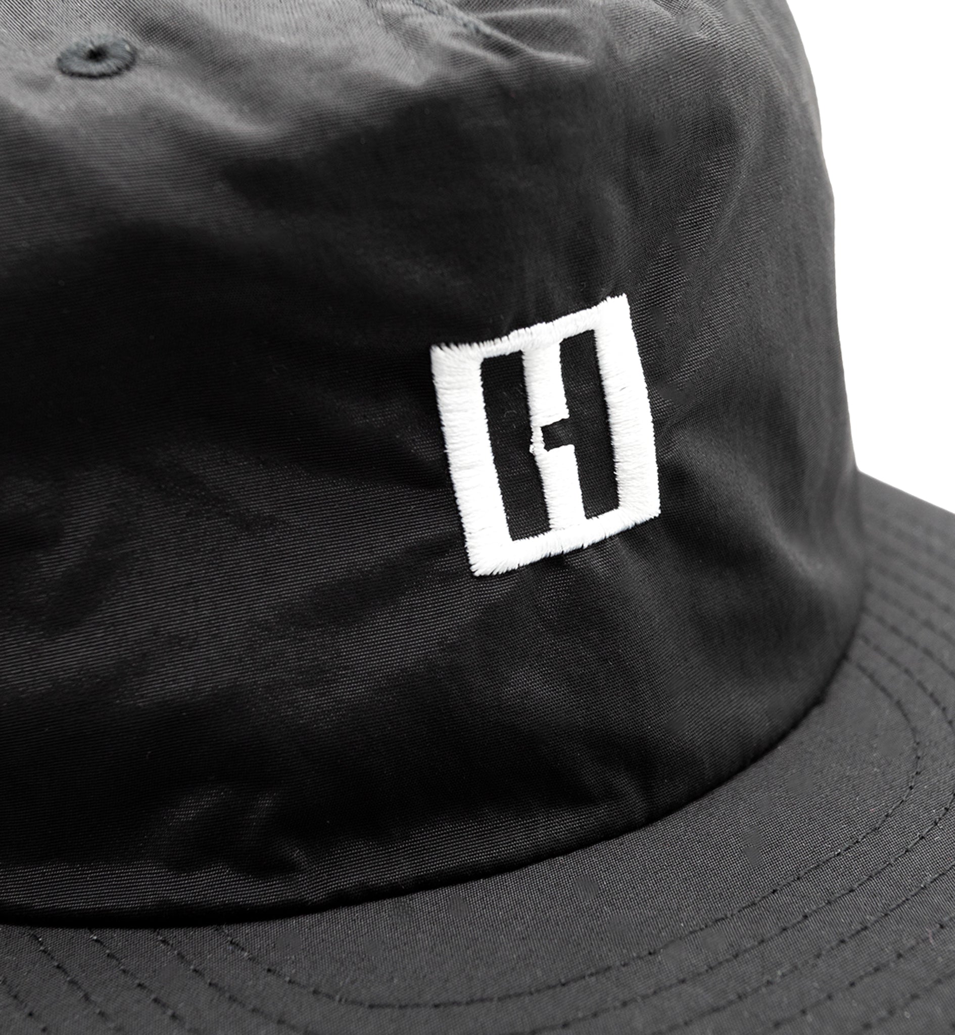 Hoonigan TIRE SLAYER unstructured snapback cap with black body and embroidered logo on the front.