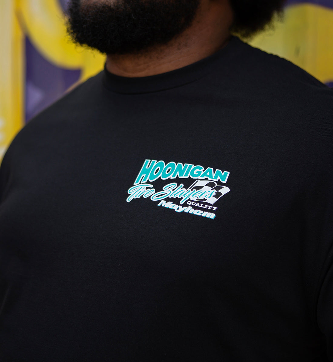 Black Hoonigan 86 Tire Slayers short sleeve tee featuring a bold graphic design on the front.