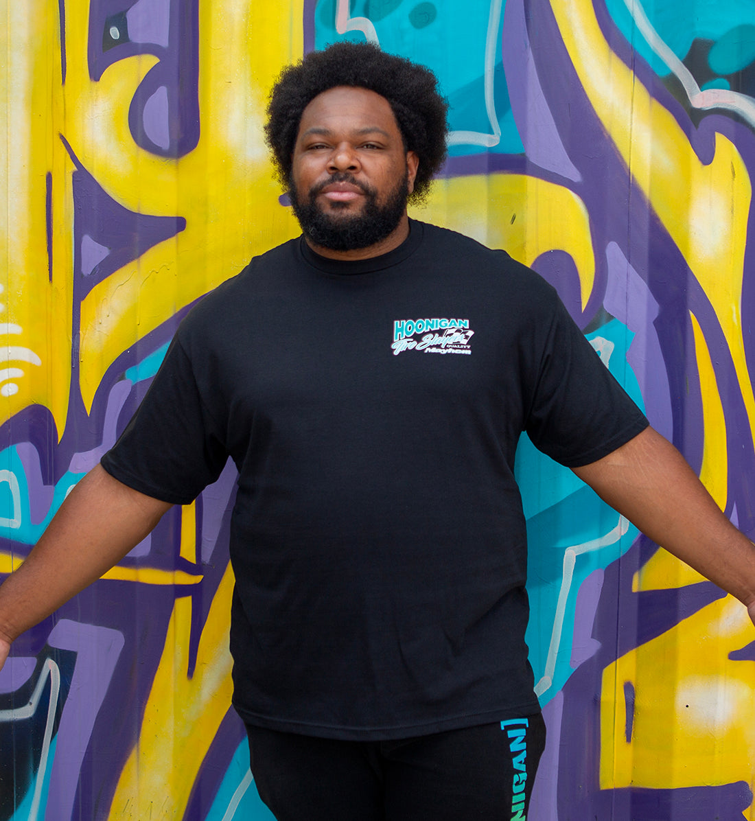 Black Hoonigan 86 TIRE SLAYERS short sleeve tee featuring a bold graphic design on the front.