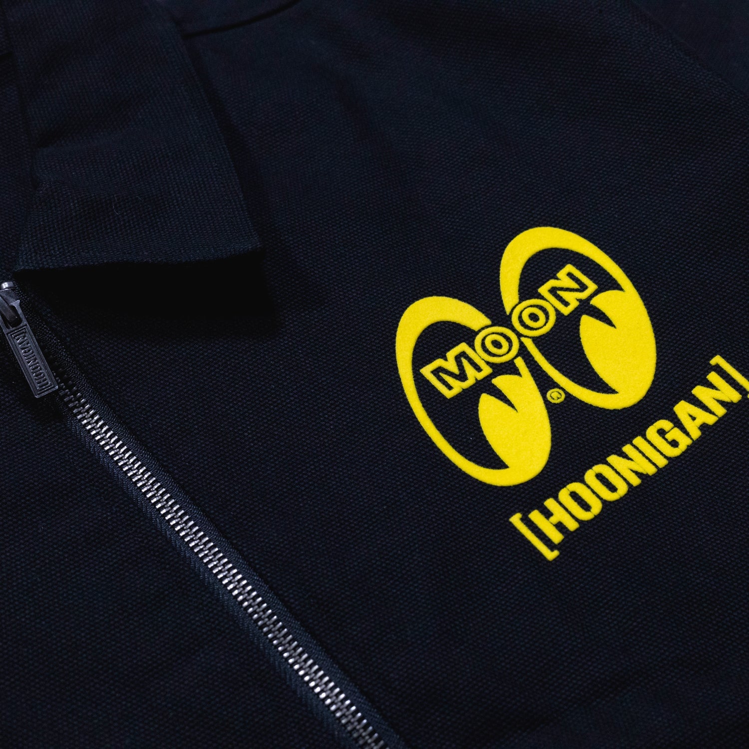 Hoonigan x Mooneyes SO CAL Jacket featuring a black design with yellow accents and branding.