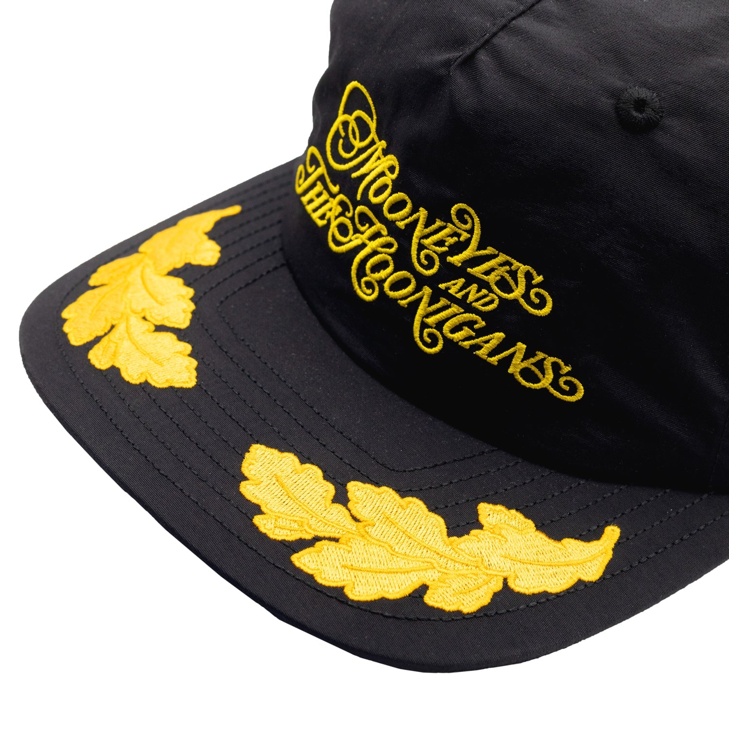 Hoonigan x Mooneyes decorated unstructured snapback hat featuring a black base and colorful embroidered logo on the front.