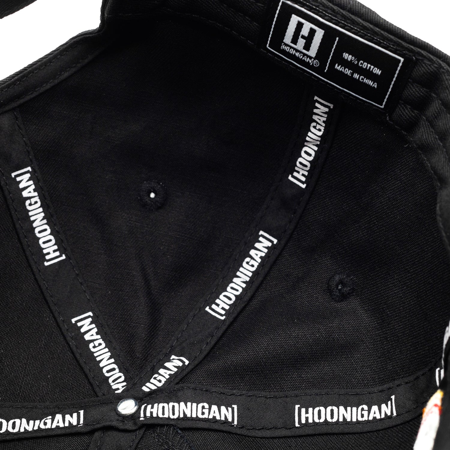 Hoonigan x RWB GROUPE RALLYE '24 unstructured strapback hat featuring a black base, embroidered logo, and adjustable back strap.