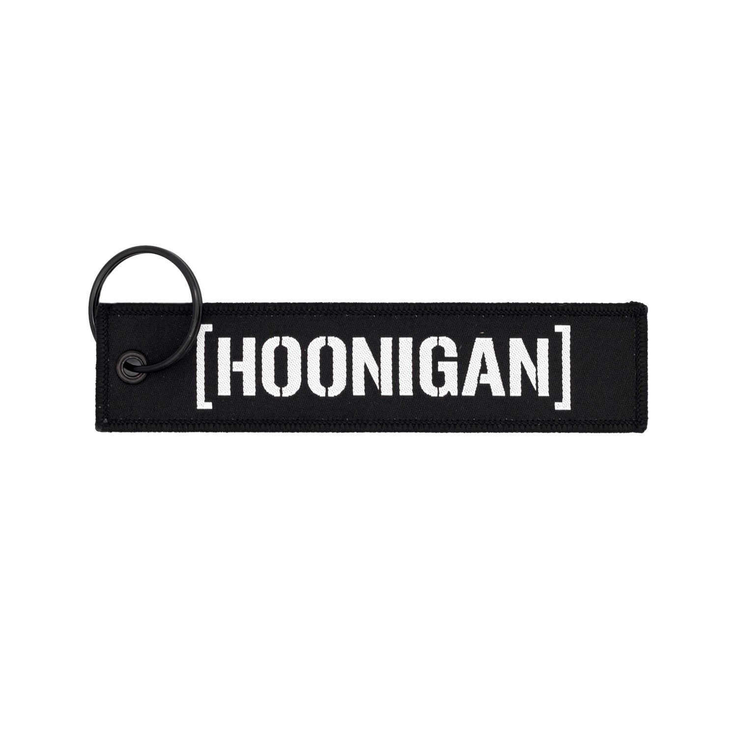 Hoonigan x Sayaka LIFE IS A CHALLENGE Jet Tag Keychain featuring a vibrant design with bold typography on a black background.