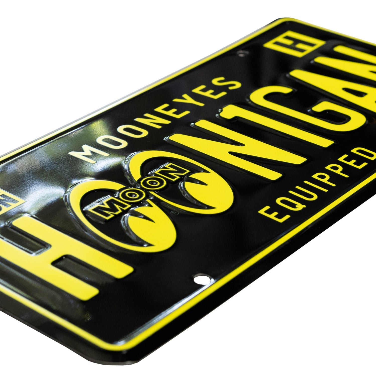 Hoonigan x Mooneyes EQUIPPED license plate featuring bold yellow lettering on a black background, perfect for car enthusiasts.