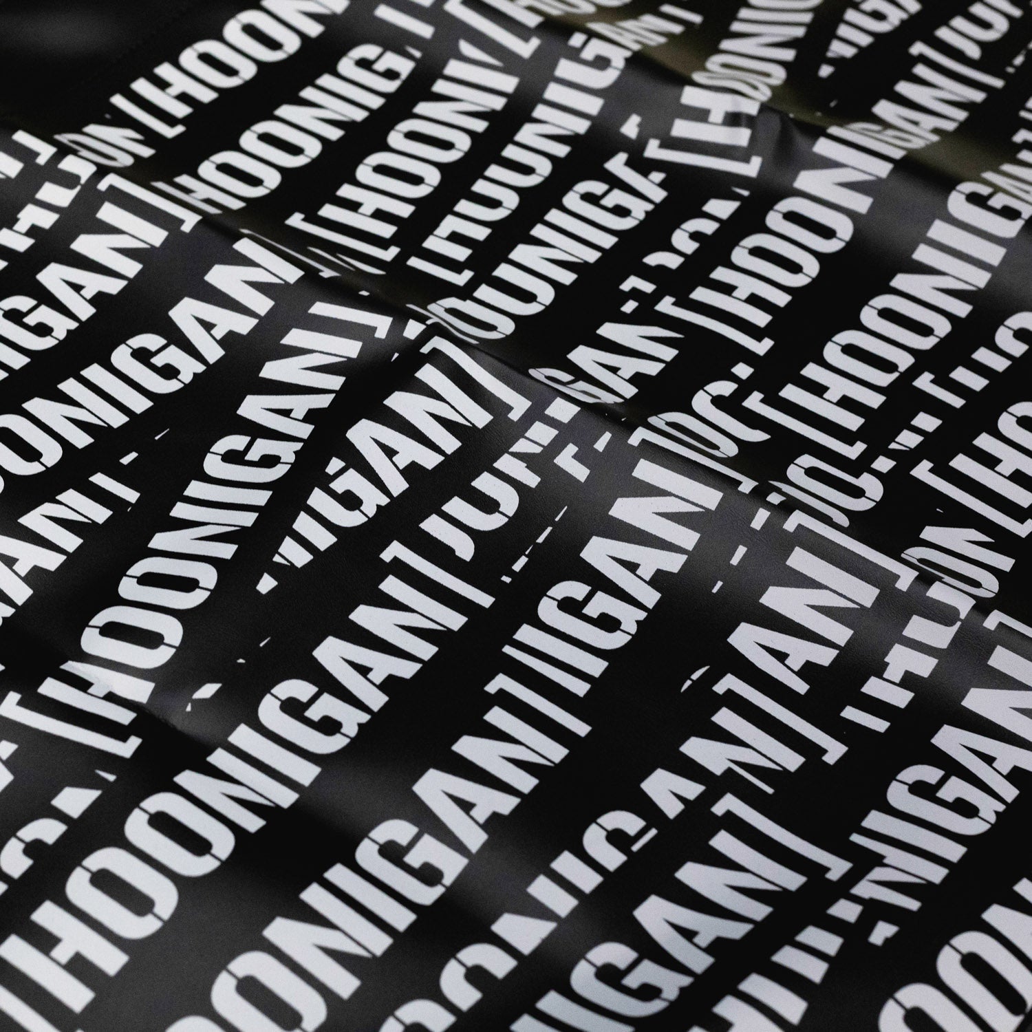 Hoonigan SCATTER PRINT Fender Cover featuring a colorful, graffiti-style design, ideal for car enthusiasts.