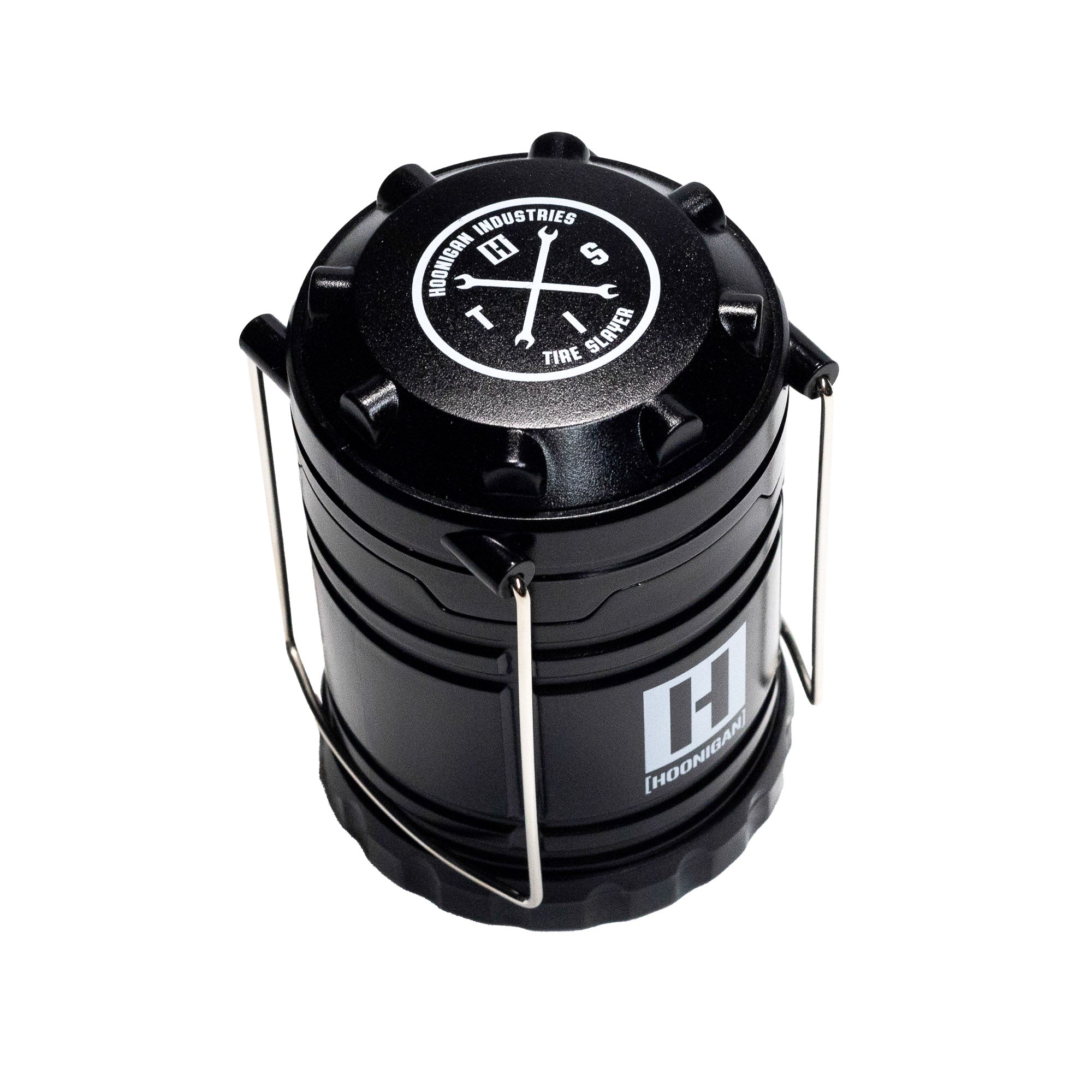 Hoonigan H.A.V.O.C. lantern with a black cylindrical design, metal handle, and white logo, used as a portable LED light or lantern.