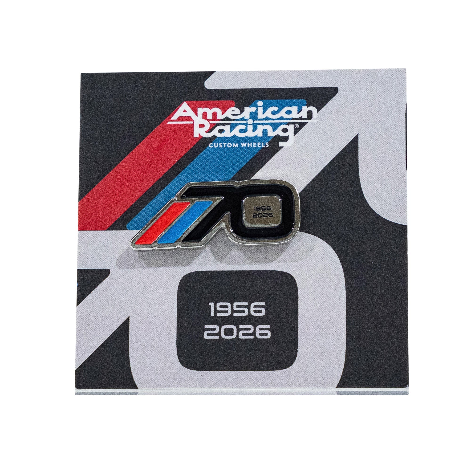 American Racing 70th anniversary collectible pin featuring a sleek design with blue and red accents, dated 1956-2026.