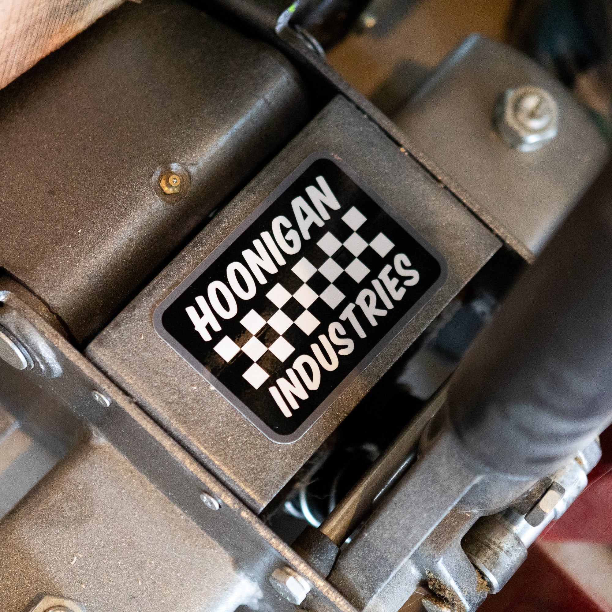 Hoonigan SPRINT sticker featuring a checkered pattern, ideal for automotive enthusiasts and motorsport fans.