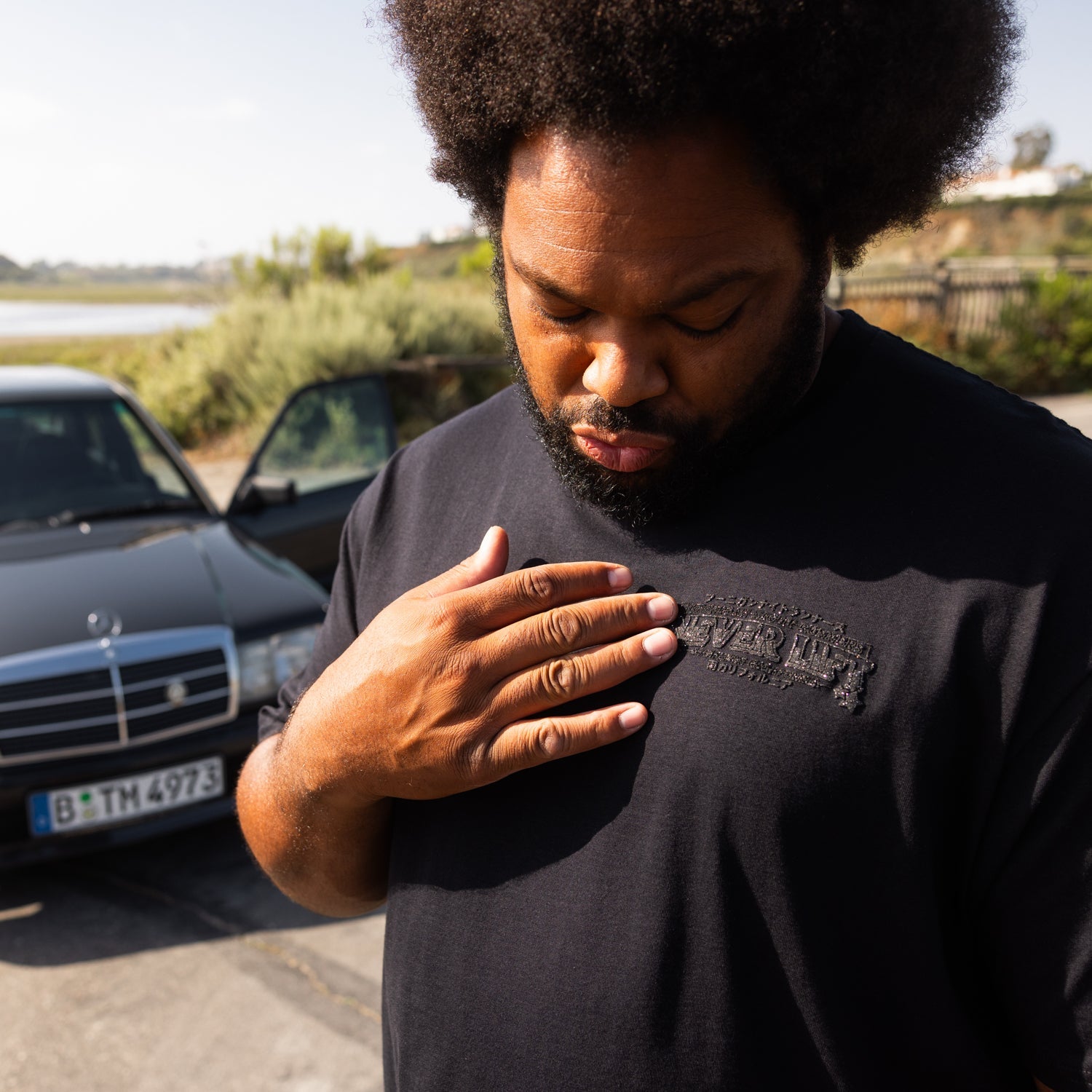 Hoonigan NIGHT RUNNERS Short Sleeve Tee featuring a bold graphic design on a black fabric, ideal for casual wear.