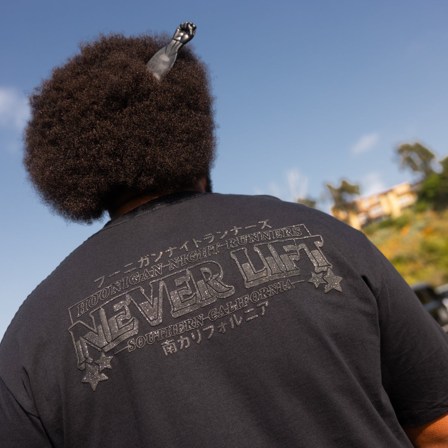 Hoonigan NIGHT RUNNERS Short Sleeve Tee featuring a graphic design on a black cotton fabric.