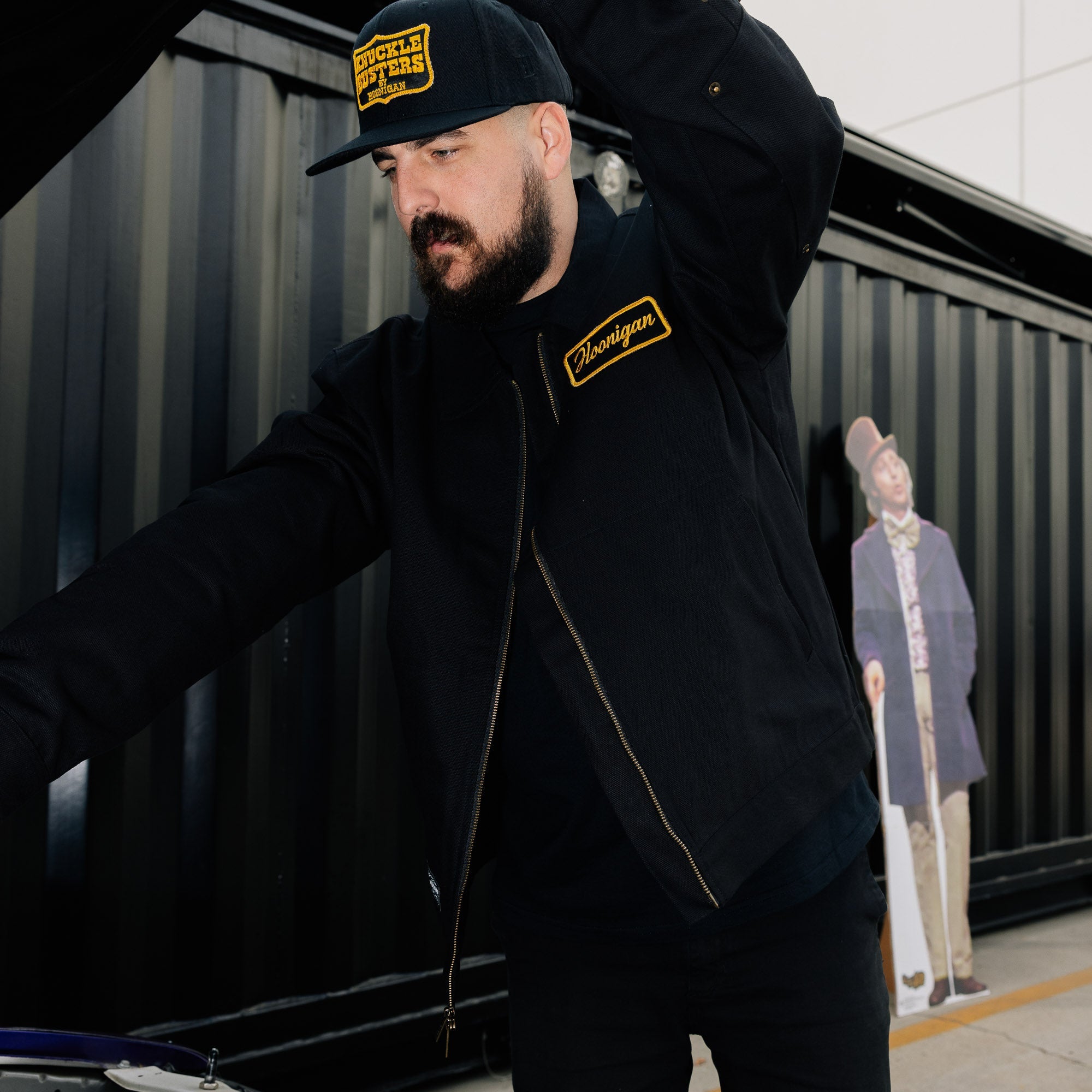 Hoonigan KNUCKLEBUSTERS jacket featuring a stylish black design with bold graphics.