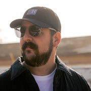 Hoonigan Motorsports unstructured dad hat in black with white logo.