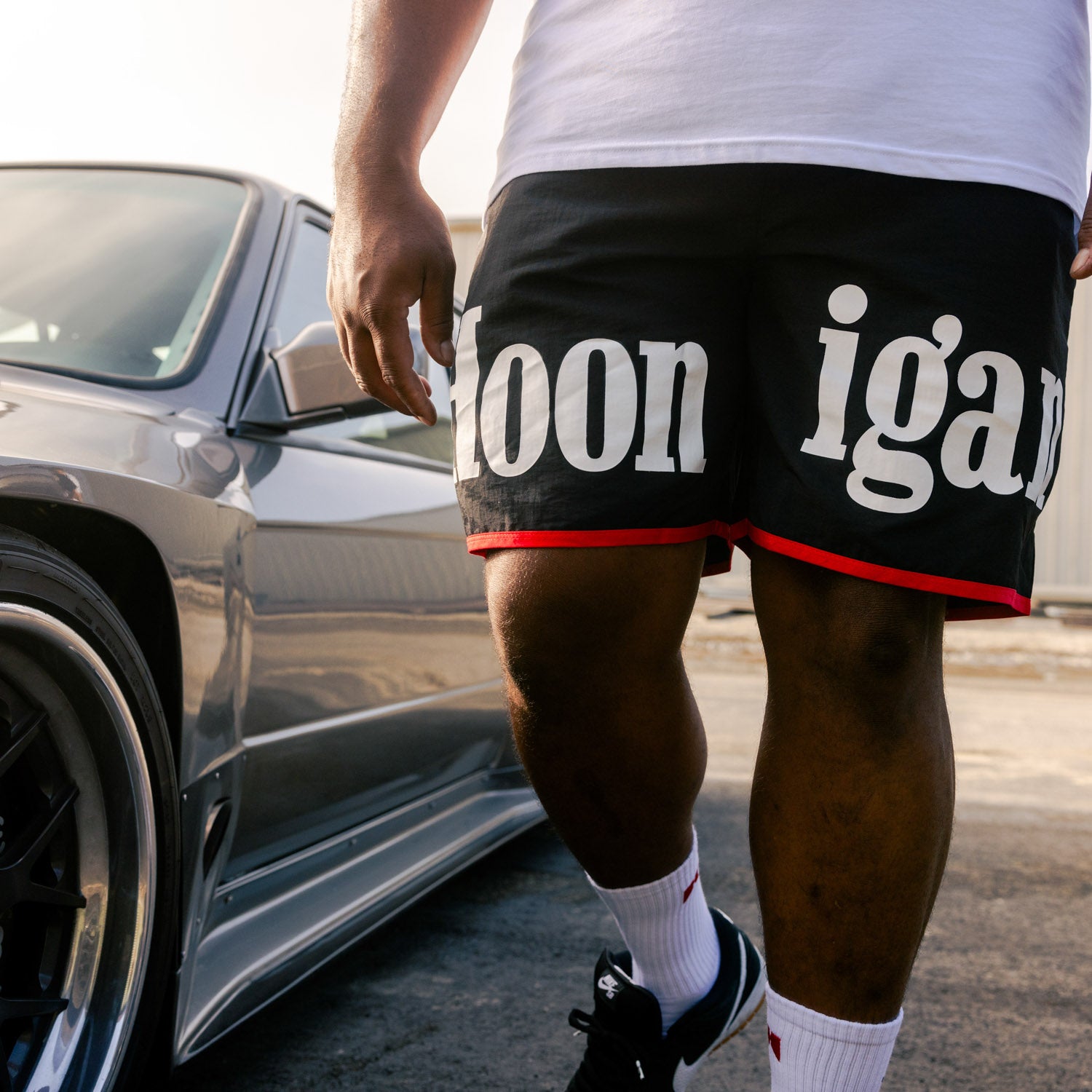 Hoonigan SURGEON GENERAL nylon shorts in black, featuring a bold logo and adjustable drawstring.
