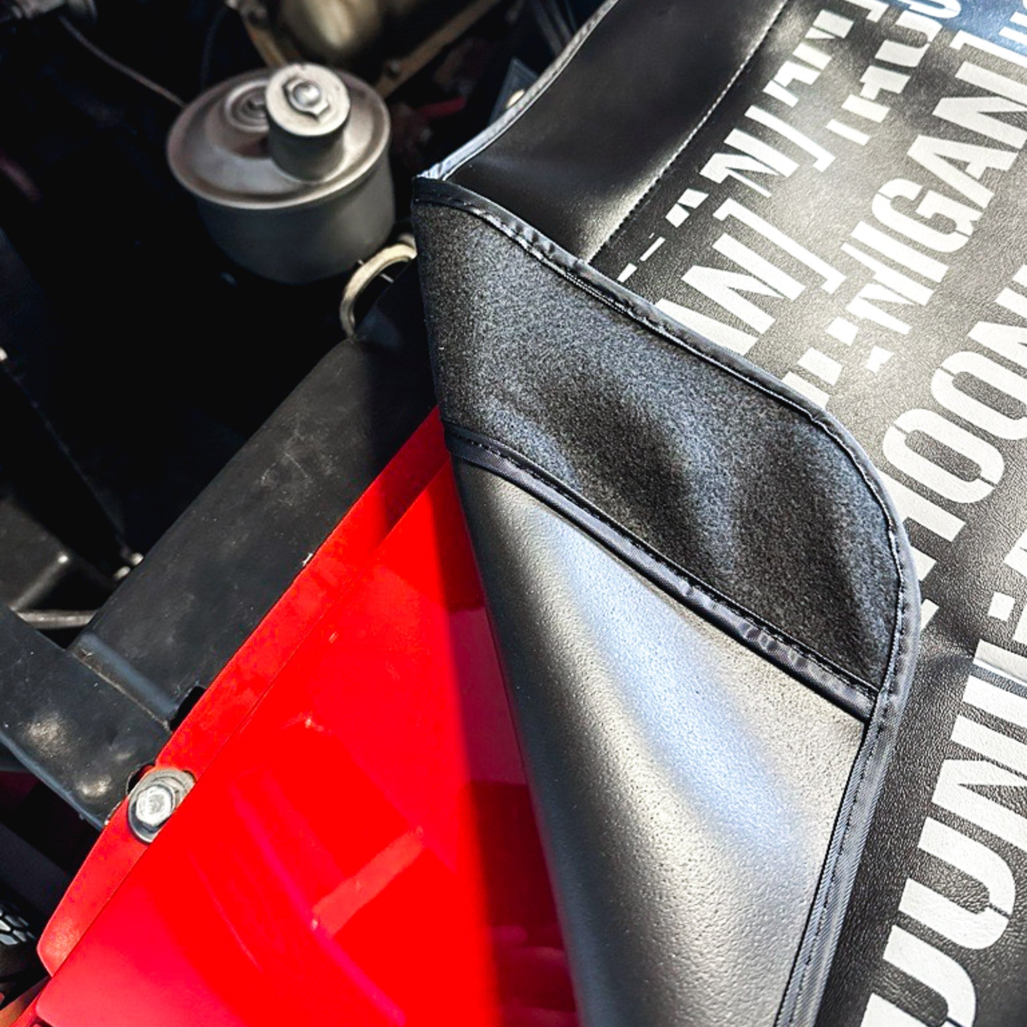 Hoonigan SCATTER PRINT Fender Cover featuring a bold, colorful design with automotive graphics.