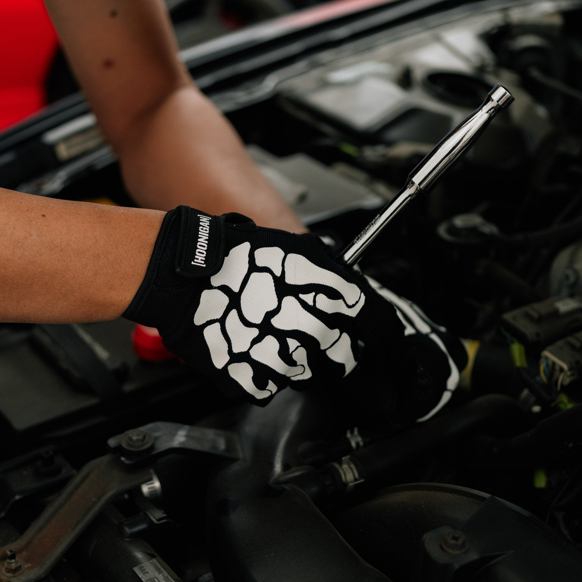 Hoonigan FIND OUT Gloves featuring a bold black design with white Hoonigan logo and durable grip for automotive work.