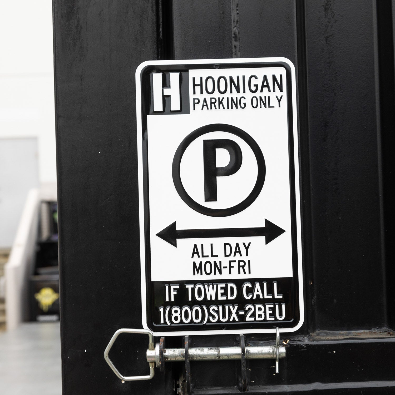 Hoonigan Parking Only Sign featuring bold black text on a white background, with a distinctive graphic design that captures a car culture aesthetic.
