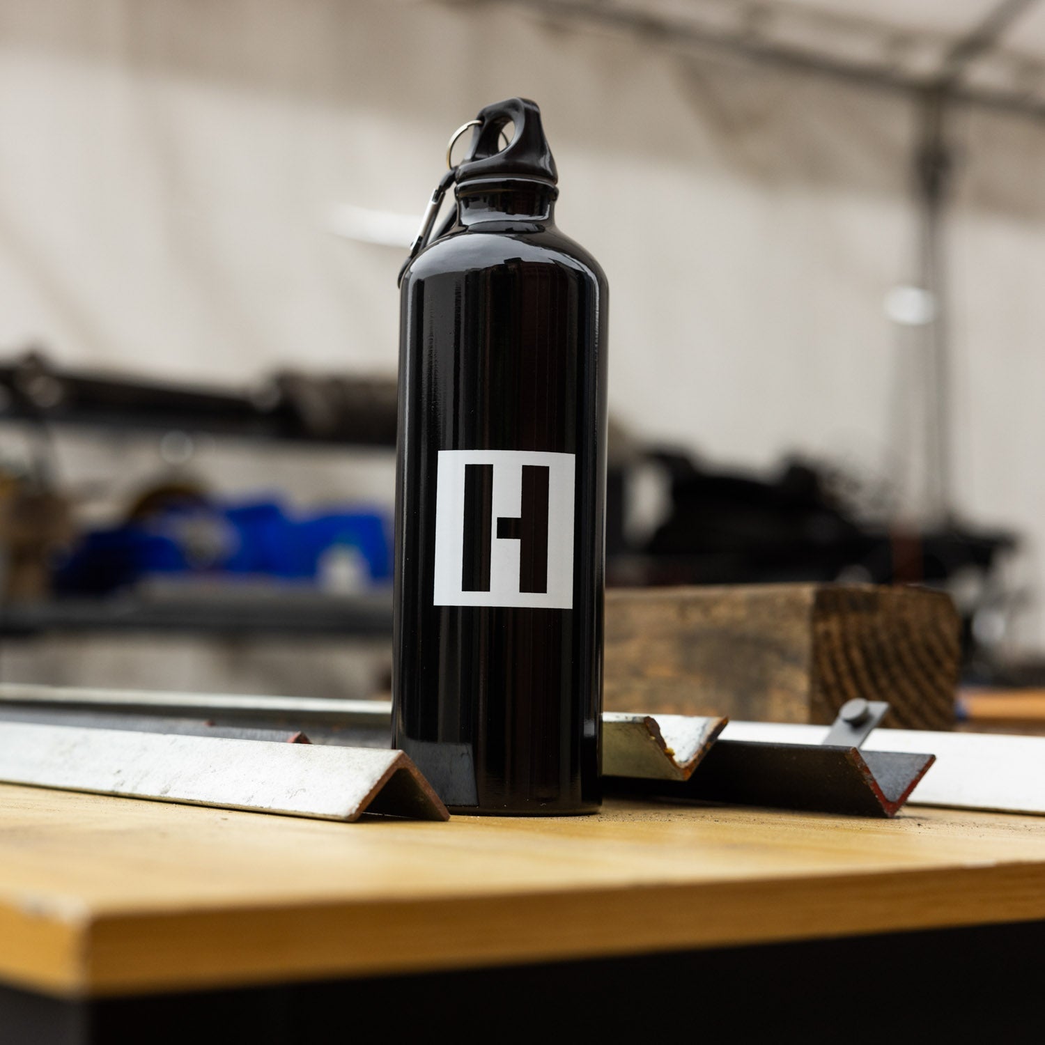 Hoonigan AMMO Water Bottle in black with a sleek design and logo prominently displayed.