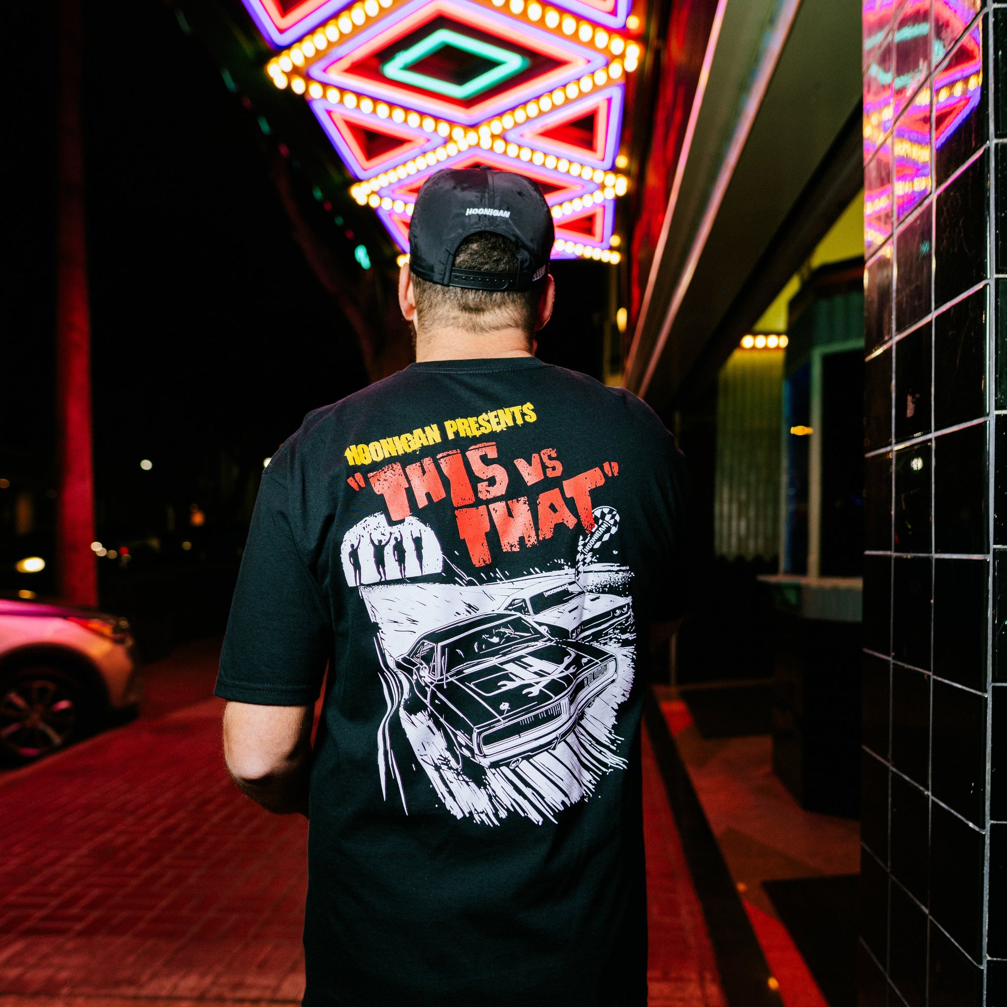 Hoonigan DOUBLE FEATURE Short Sleeve Tee in black featuring bold graphic designs on the front and back.