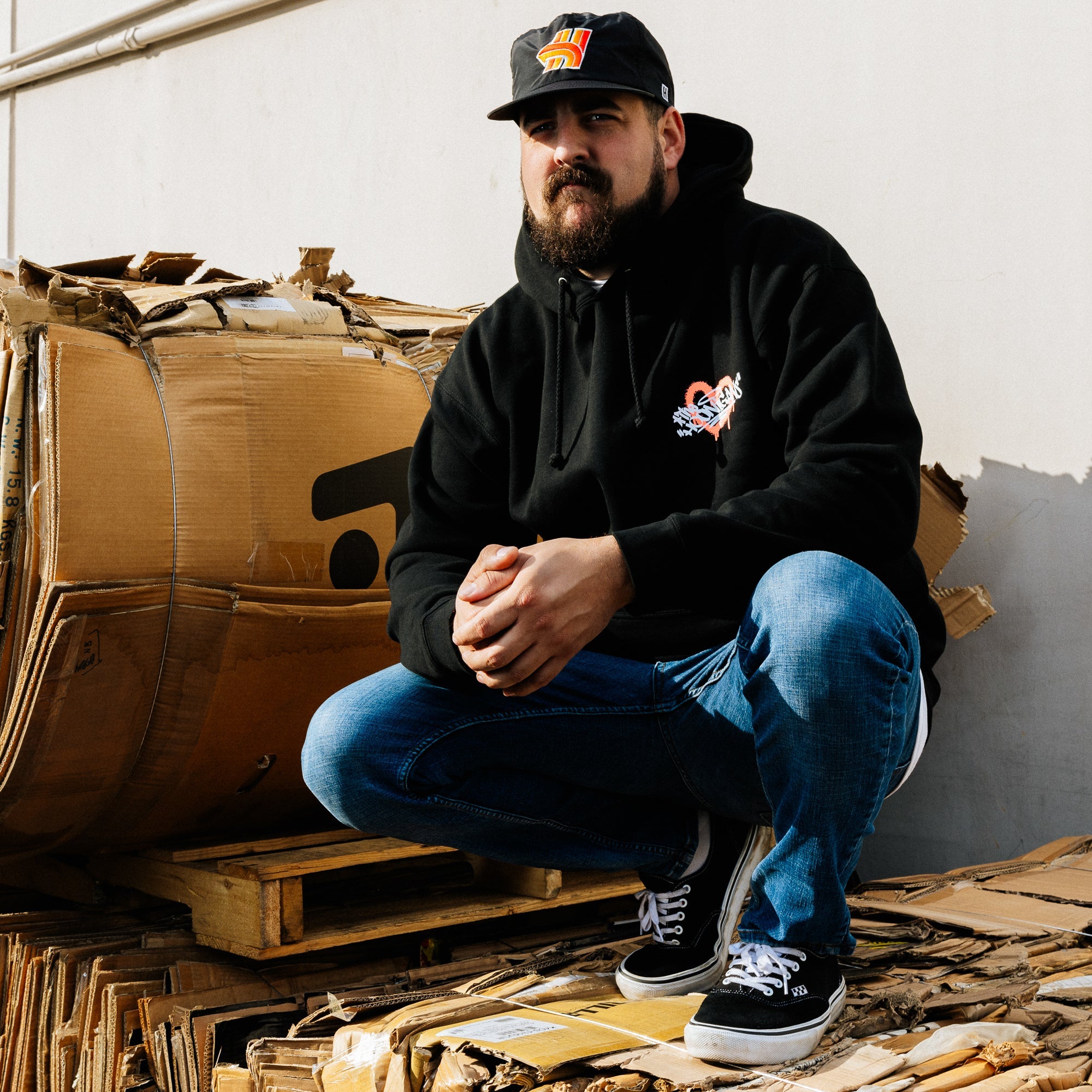 Black Hoonigan FIND OUT pullover hoodie featuring a graphic logo on the front and a drawstring hood.