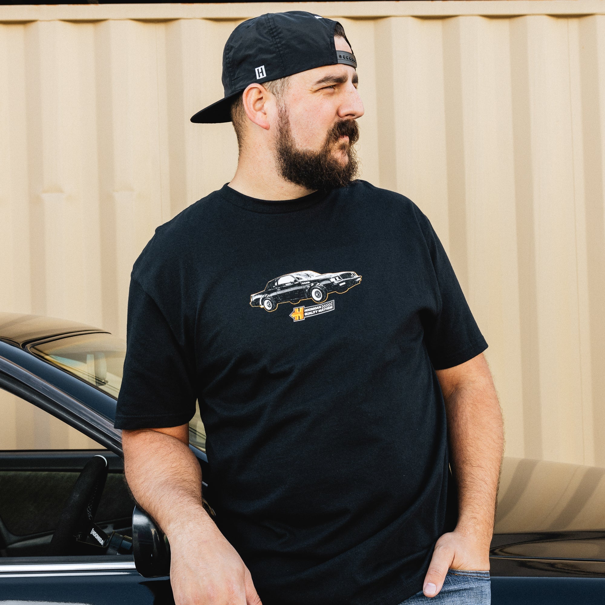 Black Hoonigan HNX short sleeve tee featuring a bold white graphic logo on the front.