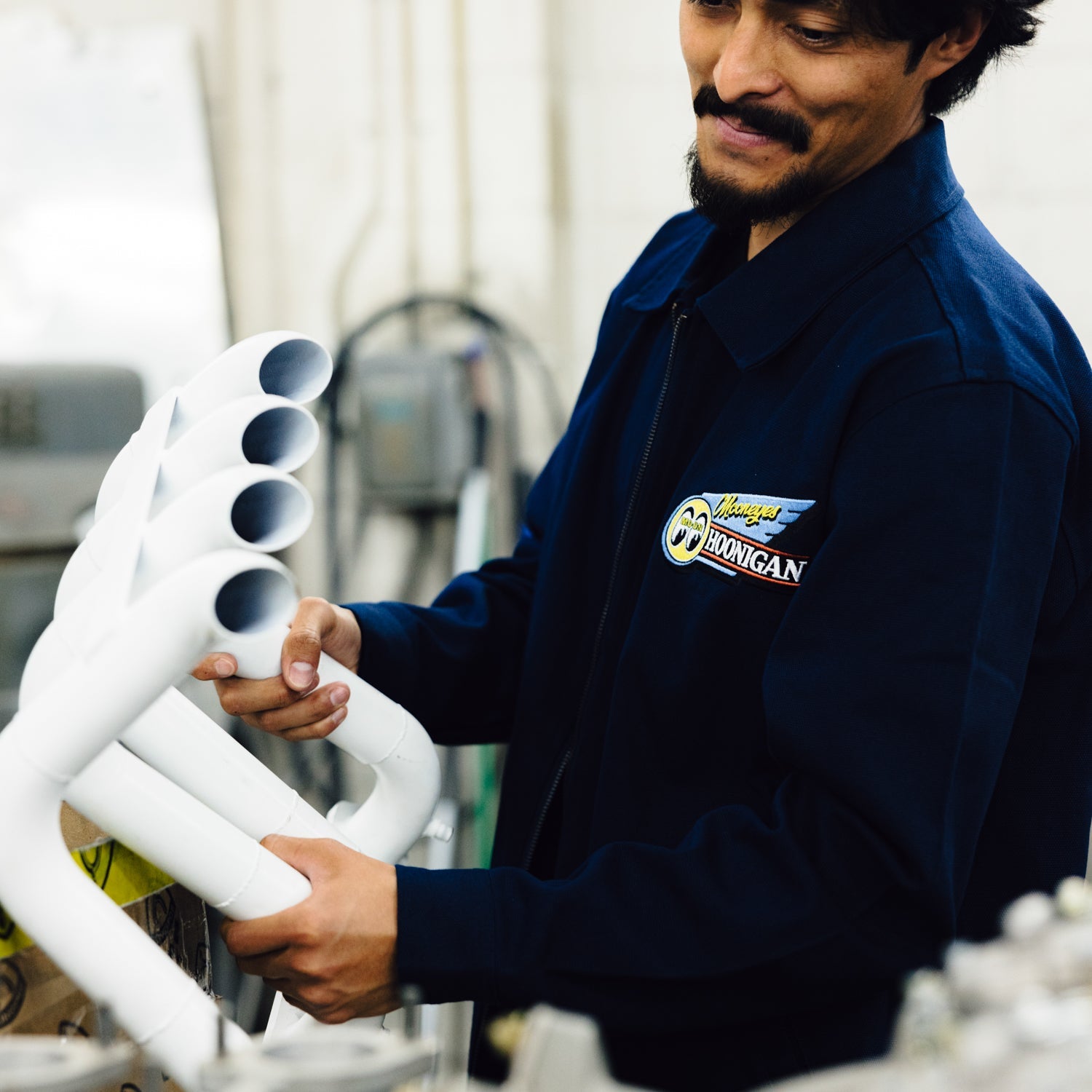 Hoonigan x Mooneyes MOON MOTEL Jacket featuring a bold graphic design and retro aesthetics in black and yellow.