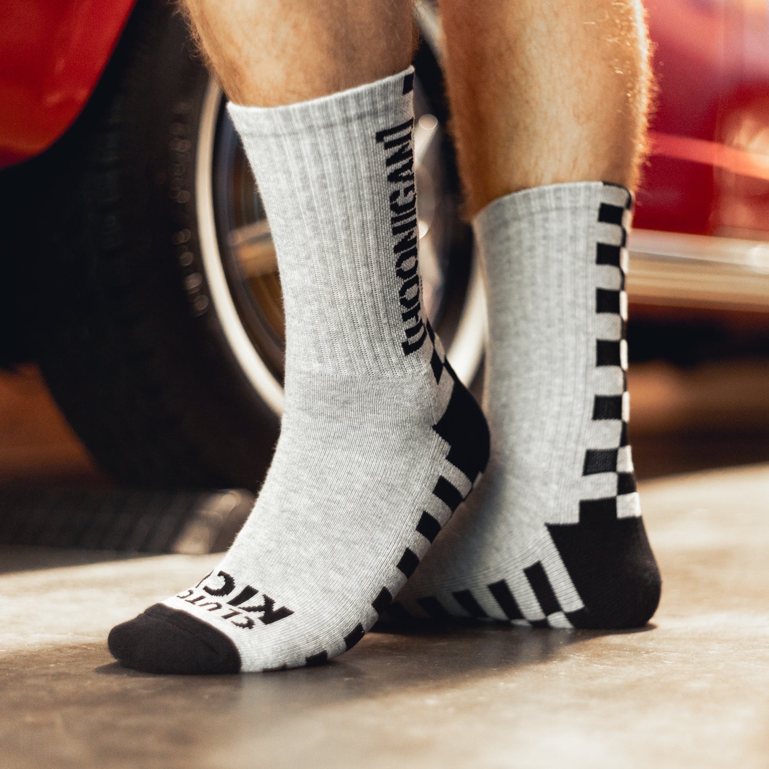 Hoonigan NEVER LIFT socks featuring a bold logo design and vibrant colors.